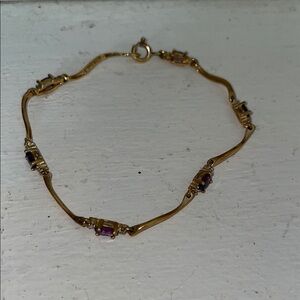 Elegant Gold and Purple Bracelet